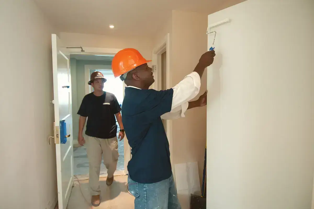Interior walls being painted after surface preparation