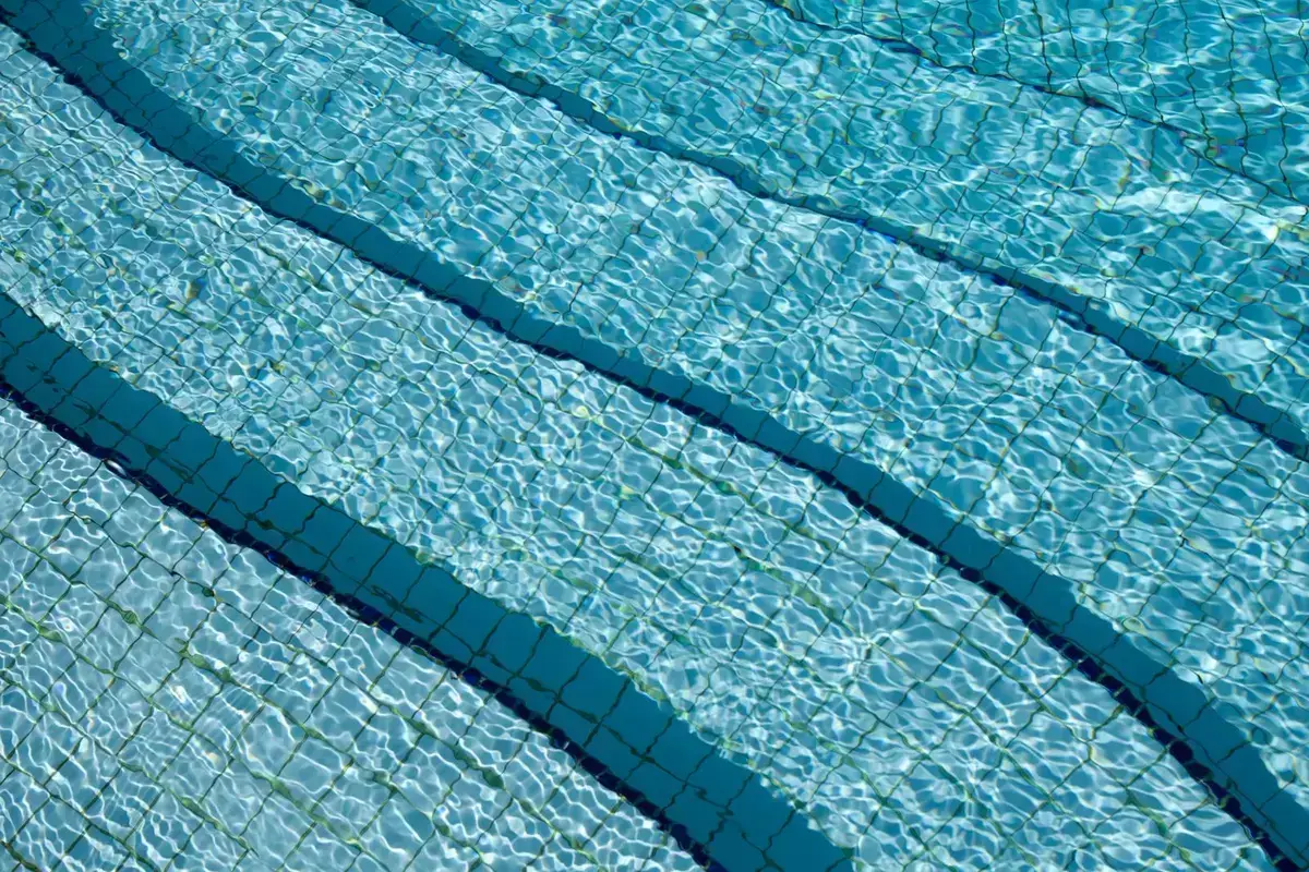 Tiled pool water after vacuuming and chemical balance