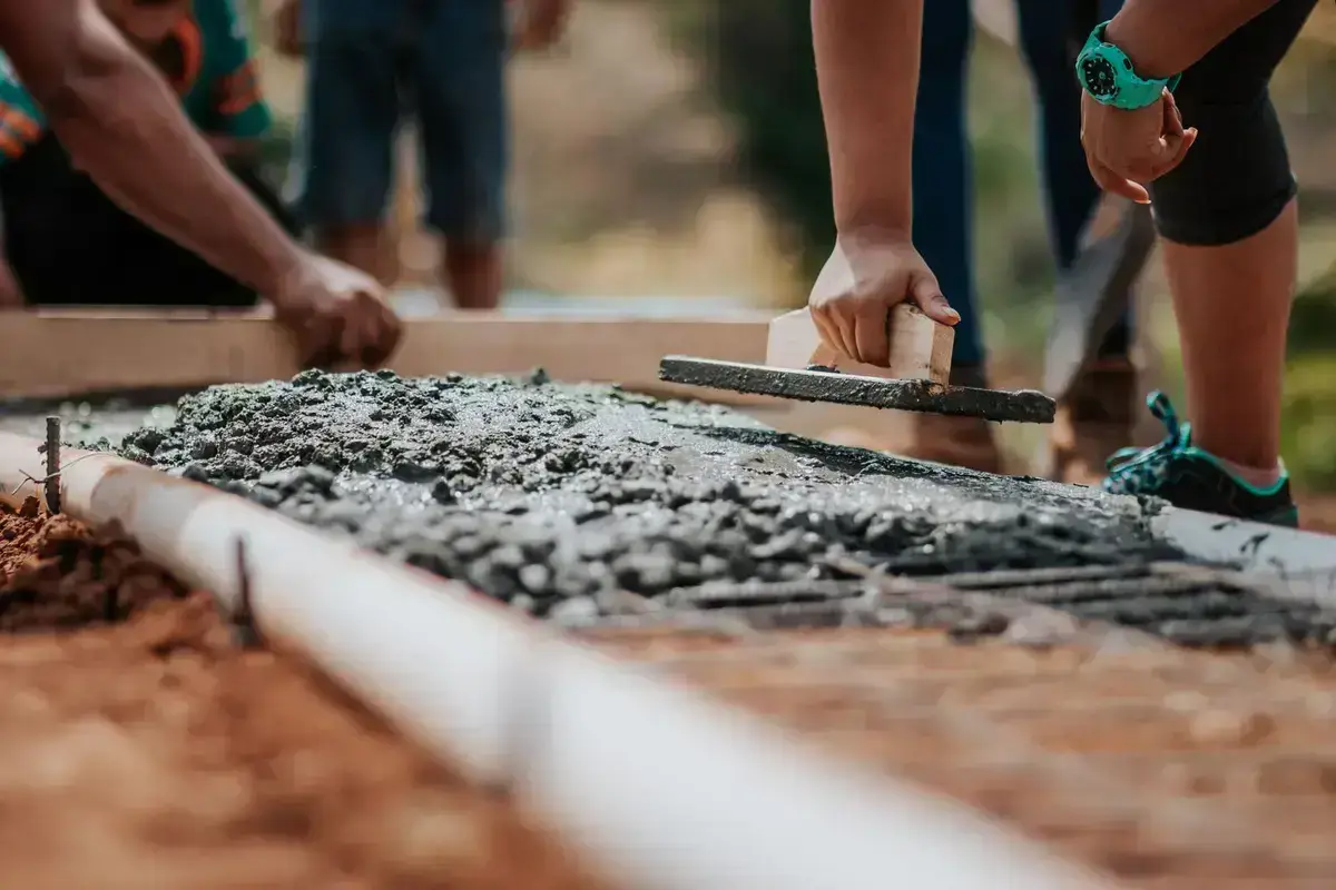 Rain shedding off a roof — the weather that finds failed membranes